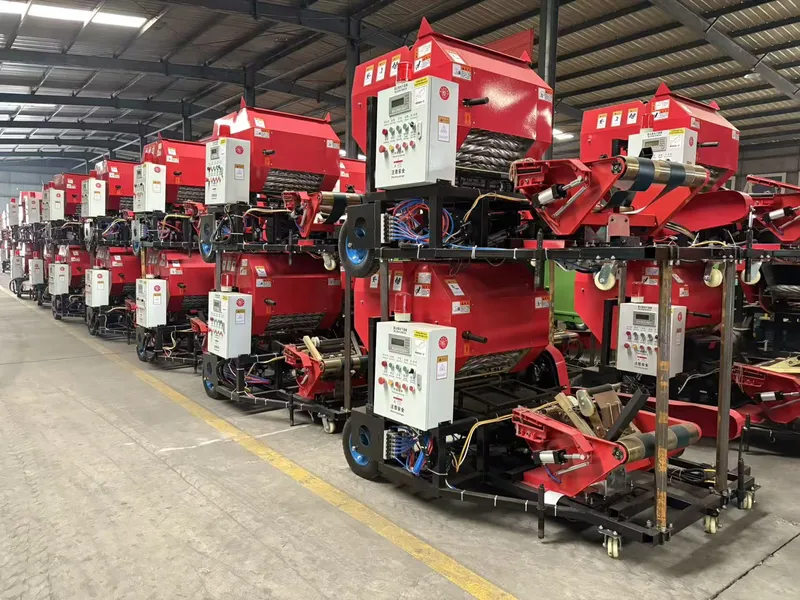 Rows of red silage baling machines in a factory